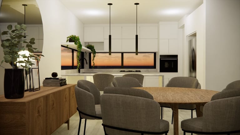 Modern kitchen and dining area with gray armchairs around a wooden table, white cabinetry, stainless steel appliances, and pendant lighting